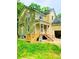 Under construction home with light beige siding and a wrap-around porch at 4504 Smoak Rd, Meggett, SC 29449
