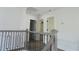 Upstairs hallway with doors to bedrooms and bathroom at 4504 Smoak Rd, Meggett, SC 29449