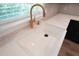 Modern kitchen sink with gold faucet and quartz countertops at 4504 Smoak Rd, Meggett, SC 29449