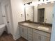 Bathroom with double vanity, granite countertop, and gold fixtures at 4504 Smoak Rd, Meggett, SC 29449