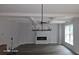 Bright living room featuring hardwood floors, a fireplace, and a stunning chandelier at 4504 Smoak Rd, Meggett, SC 29449