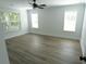 Spacious bedroom with hardwood floors and two windows at 4504 Smoak Rd, Meggett, SC 29449