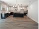 Modern kitchen with white and dark blue cabinets and a large island at 4504 Smoak Rd, Meggett, SC 29449