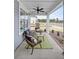Relaxing covered porch with outdoor seating and ceiling fan at 450 Ripple Park Dr, Summerville, SC 29486