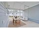 Relaxing covered patio with dining table, swing, and backyard view at 450 Ripple Park Dr, Summerville, SC 29486