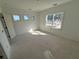 Sunlit bedroom with three windows and hardwood floors at 450 Ripple Park Dr, Summerville, SC 29486
