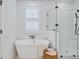 Spa-like bathroom with a freestanding soaking tub and walk-in shower at 450 Ripple Park Dr, Summerville, SC 29486