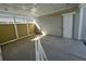 Covered patio space with concrete flooring and exterior door access at 450 Ripple Park Dr, Summerville, SC 29486