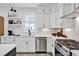 White kitchen with stainless steel appliances and herringbone backsplash at 450 Ripple Park Dr, Summerville, SC 29486