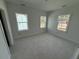 Spacious bedroom with three windows and new flooring at 450 Ripple Park Dr, Summerville, SC 29486
