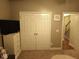 Spacious bedroom with double doors leading to a hallway and a view to the stairs at 113 Netherfield Dr, Summerville, SC 29486