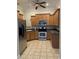 Kitchen with stainless steel appliances and oak cabinets at 86 Watershed Ct, Walterboro, SC 29488
