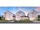 Three charming townhouses with a welcoming front yard at 412 Queenview Ln, Charleston, SC 29414