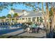 Relaxing pool area with lounge chairs and residents socializing at 196 Collared Dove Ct, Summerville, SC 29483