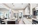 Modern kitchen with granite countertops, stainless steel appliances, and breakfast bar at 196 Collared Dove Ct, Summerville, SC 29483