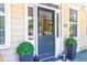 Elegant front door with glass panels and decorative planters at 312 S Gum St, Summerville, SC 29483