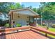 Outdoor entertaining area with a covered patio, built-in grill, and seating at 312 S Gum St, Summerville, SC 29483