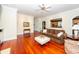 Bright living room features hardwood floors, a comfortable couch and views into the kitchen at 687 Oak Marsh Dr, Mount Pleasant, SC 29464