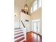 Bright and spacious entryway with hardwood floors and elegant staircase at 687 Oak Marsh Dr, Mount Pleasant, SC 29464