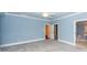 Bedroom with light blue walls, grey carpet, and walk-in closet at 687 Oak Marsh Dr, Mount Pleasant, SC 29464