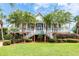 Two-story home with front porch and lush landscaping at 687 Oak Marsh Dr, Mount Pleasant, SC 29464