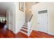 Elegant hardwood staircase with white railings in a two-story home at 687 Oak Marsh Dr, Mount Pleasant, SC 29464