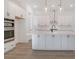 Modern kitchen with white cabinets, stainless steel appliances, and a large island at 509 Twin Lakes Dr, Summerville, SC 29483