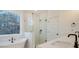Spa-like bathroom with soaking tub, walk-in shower, and marble tile at 509 Twin Lakes Dr, Summerville, SC 29483