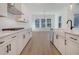 Bright kitchen with white cabinets, stainless steel appliances, and a view into the dining area at 509 Twin Lakes Dr, Summerville, SC 29483