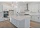Modern kitchen with white cabinets, stainless steel appliances, and a large island at 509 Twin Lakes Dr, Summerville, SC 29483