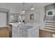Kitchen island with farmhouse sink and white cabinetry at 315 Ashley Ave # C, Charleston, SC 29403