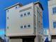 Three-story home with gray siding and garage at 315 Ashley Ave # C, Charleston, SC 29403