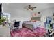 Spacious bedroom with a large bed, desk, and pink rug at 315 Ashley Ave # C, Charleston, SC 29403