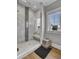 Luxury bathroom with a large walk-in shower and marble tile at 315 Ashley Ave # C, Charleston, SC 29403