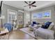 Spacious living room with sectional sofa, hardwood floors, and ceiling fan at 315 Ashley Ave # C, Charleston, SC 29403