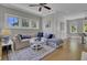 Bright living room with sectional sofa and hardwood floors at 315 Ashley Ave # C, Charleston, SC 29403
