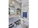 Updated bathroom features gray vanity, marble countertop, and herringbone floor tile at 315 Ashley Ave # C, Charleston, SC 29403
