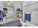 Modern bathroom with a gray vanity, marble countertop, and a glass shower at 315 Ashley Ave # C, Charleston, SC 29403