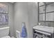 Small bathroom with pedestal sink and gray walls at 315 Ashley Ave # C, Charleston, SC 29403