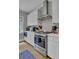 Modern kitchen with stainless steel appliances and white cabinetry at 315 Ashley Ave # C, Charleston, SC 29403