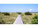 Scenic boardwalk winds through dunes toward the beach at 1394/96 Pelican Watch Villas, Seabrook Island, SC 29455
