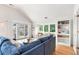 Spacious living area featuring hardwood floors, comfy seating, and access to a deck at 1394/96 Pelican Watch Villas, Seabrook Island, SC 29455