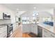 Open concept kitchen with granite island and ocean view at 1394/96 Pelican Watch Villas, Seabrook Island, SC 29455
