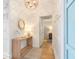 Bright and airy entryway with wood console table and mirror at 1394/96 Pelican Watch Villas, Seabrook Island, SC 29455