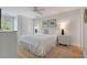 Bright bedroom with a queen bed, wood floors, and plenty of natural light at 1394/96 Pelican Watch Villas, Seabrook Island, SC 29455