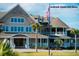 Large clubhouse with American and state flags at 1394/96 Pelican Watch Villas, Seabrook Island, SC 29455
