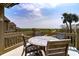 Deck with wooden table and chairs overlooking ocean at 1394/96 Pelican Watch Villas, Seabrook Island, SC 29455