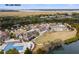 Aerial view of lake house with pool and surrounding landscape at 1394/96 Pelican Watch Villas, Seabrook Island, SC 29455