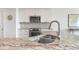 Modern kitchen with granite countertops, stainless steel appliances, and white cabinets at 1394/96 Pelican Watch Villas, Seabrook Island, SC 29455