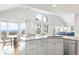 Open concept kitchen with granite island and ocean view at 1394/96 Pelican Watch Villas, Seabrook Island, SC 29455